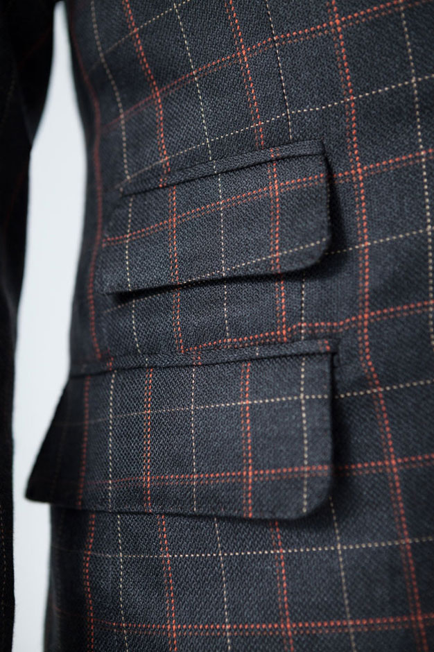 Close-up of a ticket pocket of a bespoke silk suit