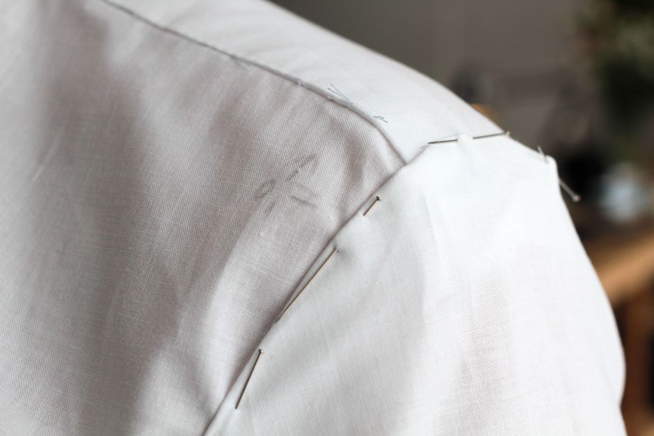 Adjusting the shoulder of a bespoke trial shirt